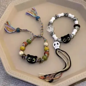 ست دستبند بافتنی زنانه و مردانه طرح اسکلت و گربه ۲ عددی
