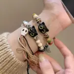 ست دستبند بافتنی زنانه و مردانه طرح اسکلت و گربه ۲ عددی
