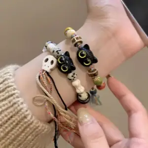 ست دستبند بافتنی زنانه و مردانه طرح اسکلت و گربه ۲ عددی